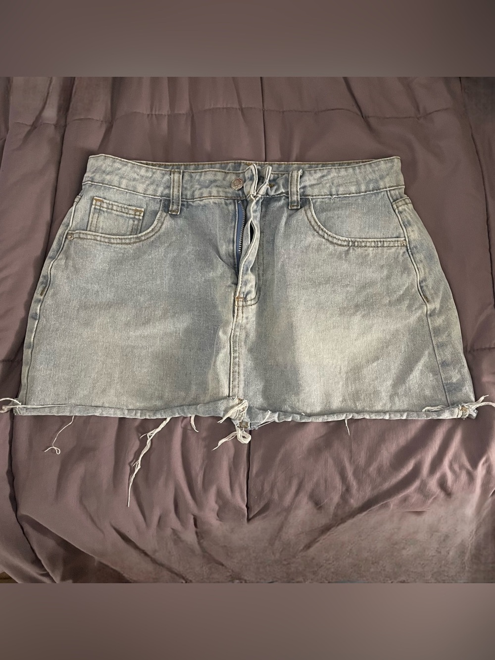 Light Blue Denim Skirt with Distressed Detail